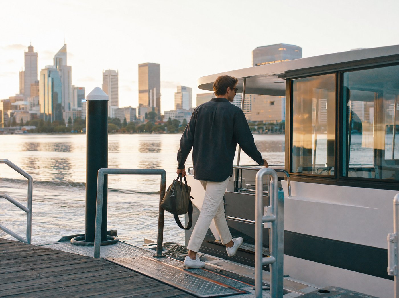 Boarding the South Perth ferry with the Perth CBD skyline beyond